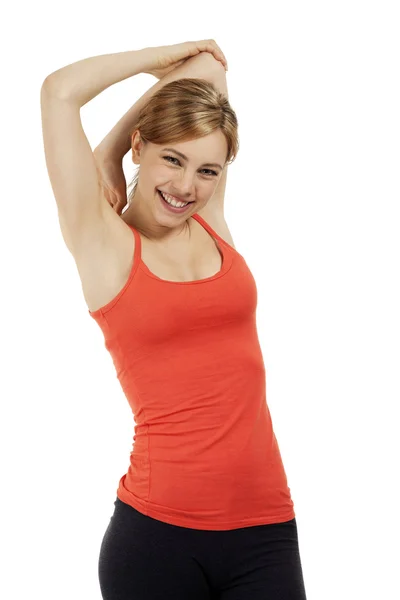 Šťastný fitness žena protáhnout své paže — Stock fotografie