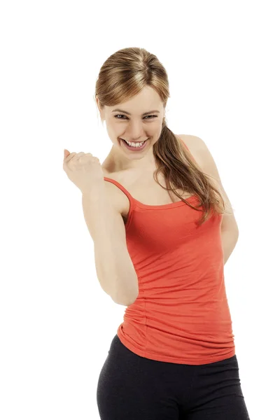 Mulher fitness bem sucedida mostrando seu punho — Fotografia de Stock