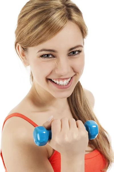Happy young woman with a dumbbell — Stock Photo, Image