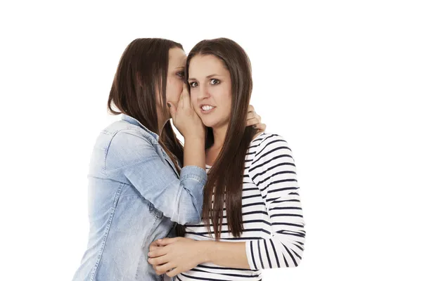 Teenager whispering her friend in her ear — Stock Photo, Image