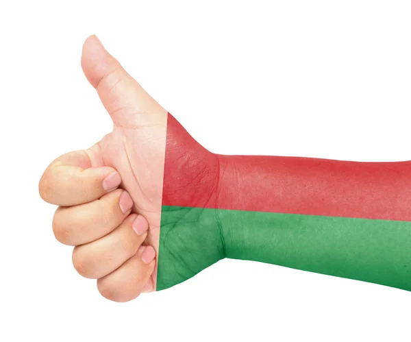 Madagascar bandiera sul pollice in su gesto come icona — Foto Stock