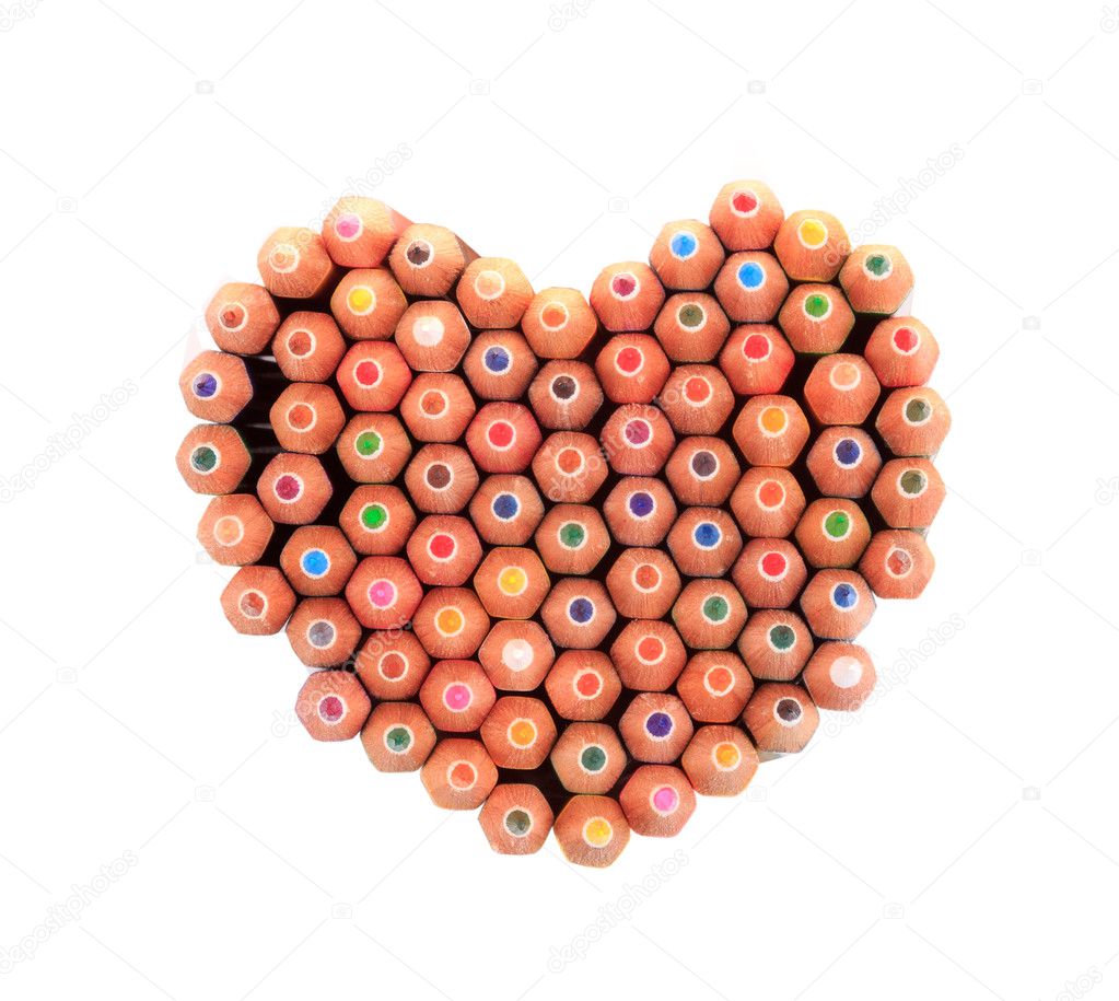 Color pencils arrange in heart shape isolated on white background close up