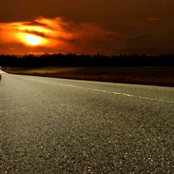 Carretera y puesta del sol — Stok fotoğraf