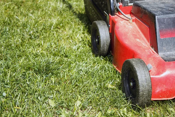 Detail of lawnmower on green grass — Stock Photo, Image