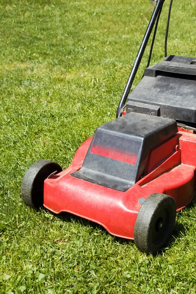 Lawnmower on green grass — Stock Photo, Image