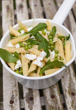Pasta with goatcheese and rocket clipart