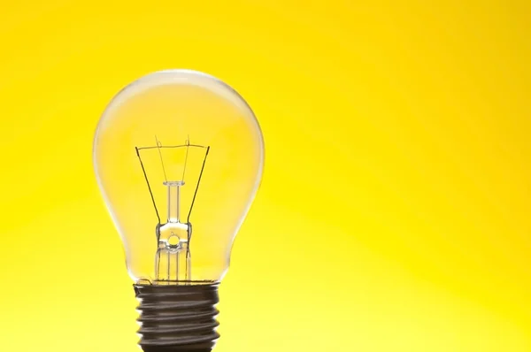 Lamp as yellow background — Stock Photo, Image