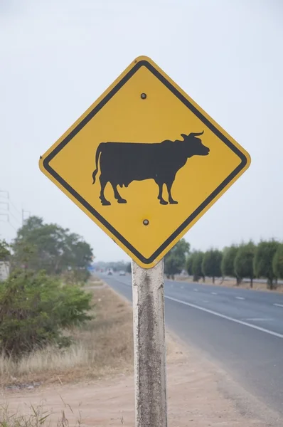 stock image Cow symbol as the road background