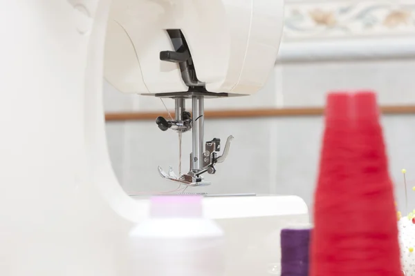 Sewing machine and needle — Stock Photo, Image