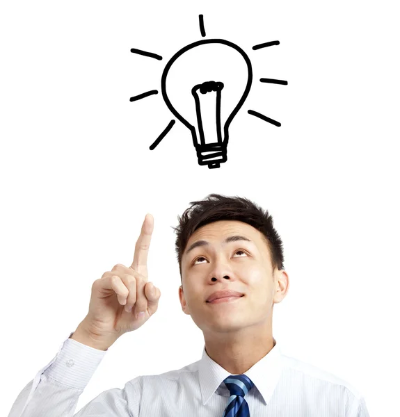Jonge zakenman wijzen lamp en idee concept — Stockfoto