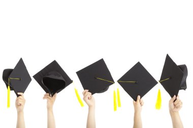 Many hand holding graduation hats and isolated on white clipart