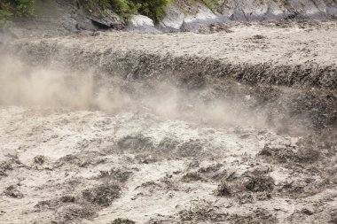 The river in flooding after heavy rains clipart