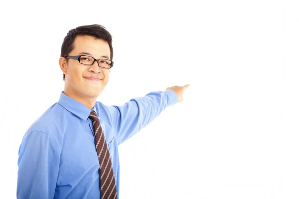 Asian young business man pointing at something — Stock Photo, Image