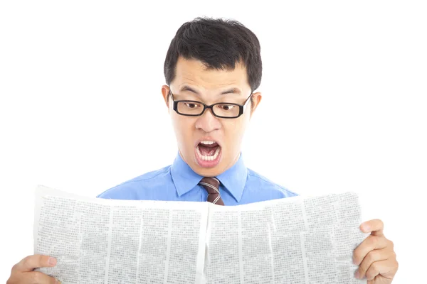 Surprised businessman watching the newspaper — Stock Photo, Image