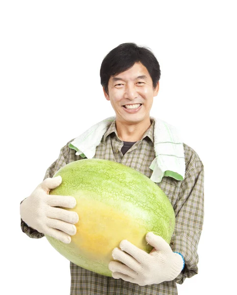 Happy middle aged asian farmer holding big watermelon — Stock Photo, Image