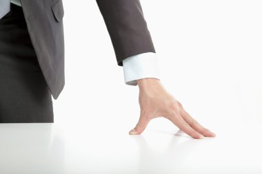 Businessman 's hand put on the table clipart