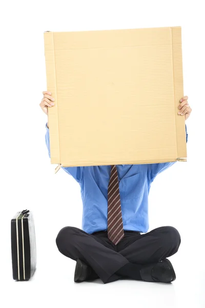 Podnikatel drží prázdné karton — Stock fotografie