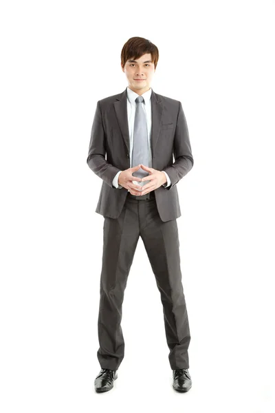 Intelligens ázsiai üzletember állandó fehér háttér — Stock Fotó