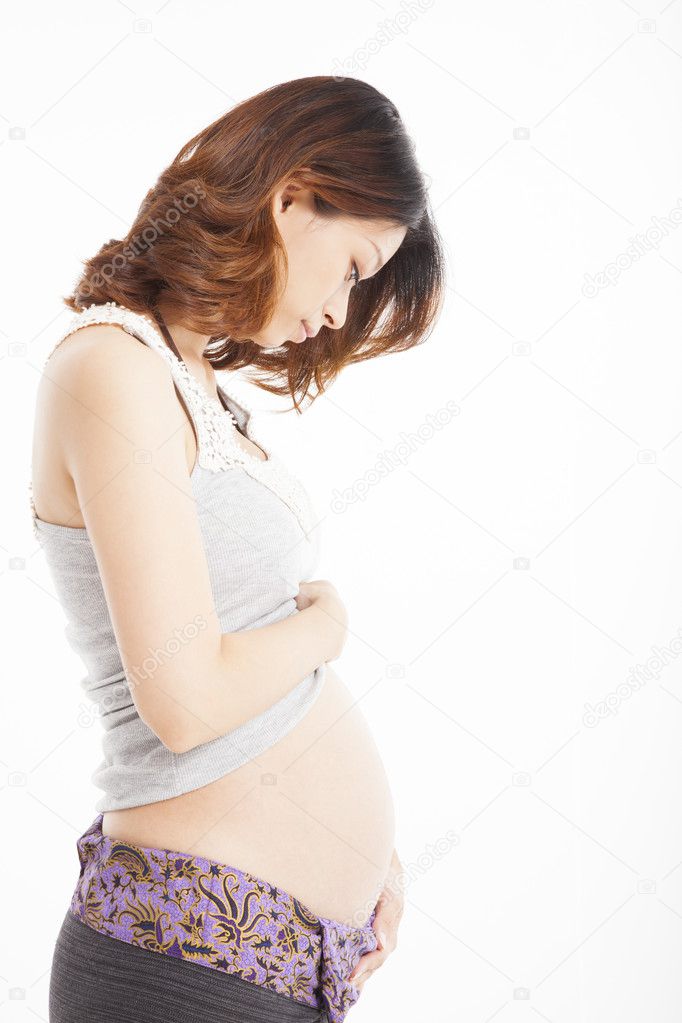 Asian pregnant woman caressing her belly