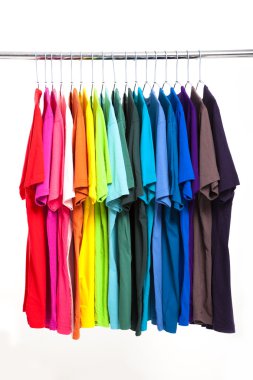 Colorful t-shirt with hangers isolated on white clipart