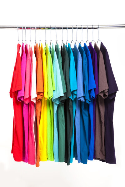 Colorful t-shirt with hangers isolated on white