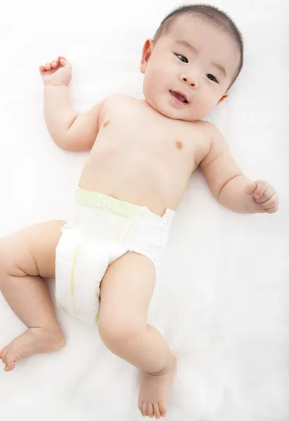 Asian baby lying on the bed — Stock Photo, Image