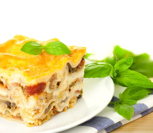 Delicious Italian Lasagna / with fresh basil / white background — Stock Photo, Image