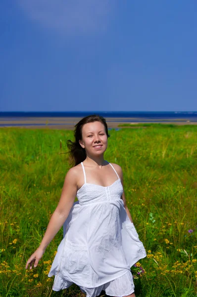 Girl walking in field Stock Image