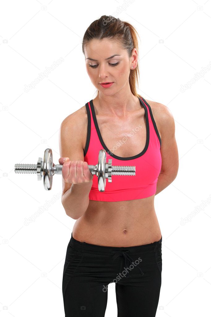 Young woman lifting a dumbbell