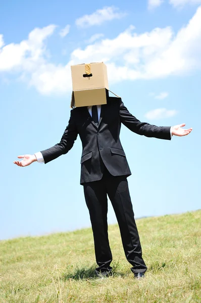 Business man with box on head — Stock Photo, Image