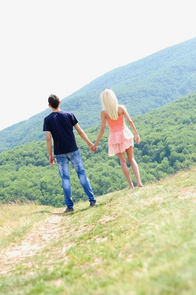 Young couple holding hand — Stock Photo, Image