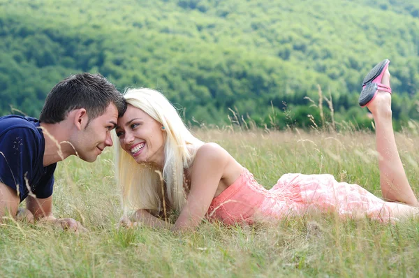 Young couple in nature — Stock Photo, Image