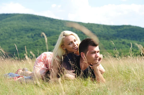 Young couple laying — Stock Photo, Image