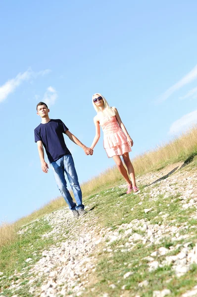 Young couple holding hand — Stock Photo, Image