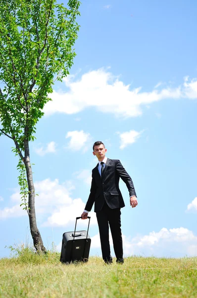 Homem de negócios com bagagem — Fotografia de Stock