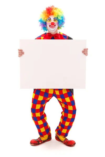 Клоун держит пустую белую доску — стоковое фото