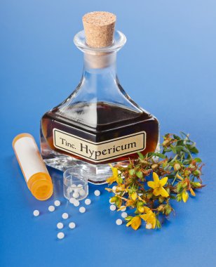 Hypericum plant and extract and homeopathic pills clipart