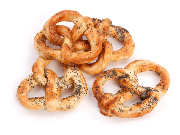 Vários pretzels com sementes de papoila — Fotografia de Stock
