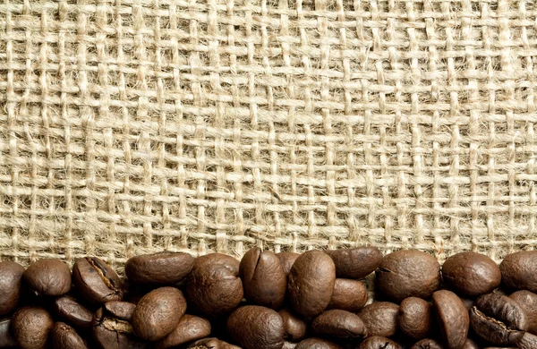 stock image Coffee beans on burlap