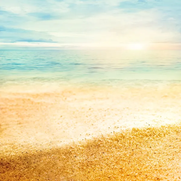 Закат и мелкий песок — стоковое фото