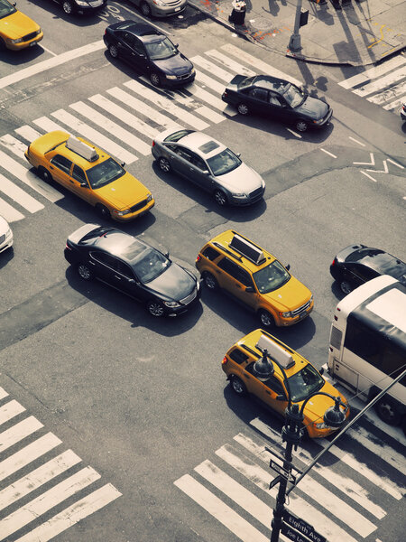 Typical yellow cabs and other cars in the streets of Manhattan