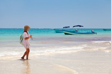 Girl having a walk in Palaya Paraiso, Mayan Riviera clipart