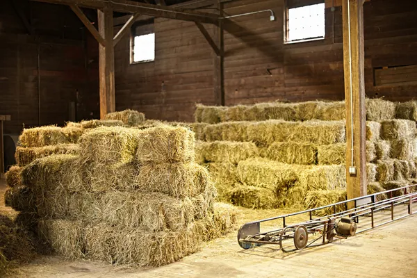 Interior of barn with hay bales — Stock Photo, Image