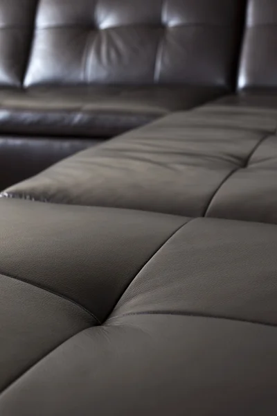 Black leather sofa — Stock Photo, Image