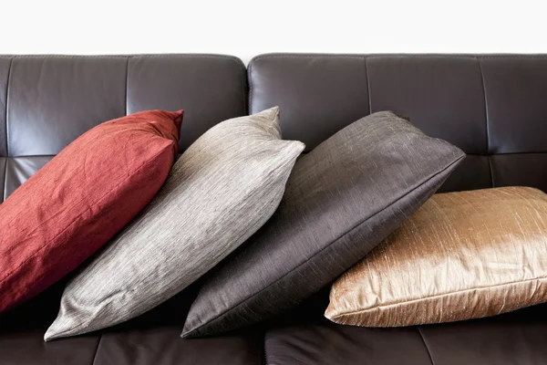 Cushions on leather sofa — Stock Photo, Image