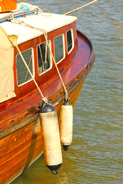 Side view of a wooden vintage boat in the harbor — Stock Photo, Image