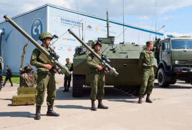 Soldiers demonstrate military equipment clipart