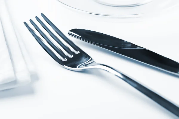 Fork and knife in elegant table setting Stock Image