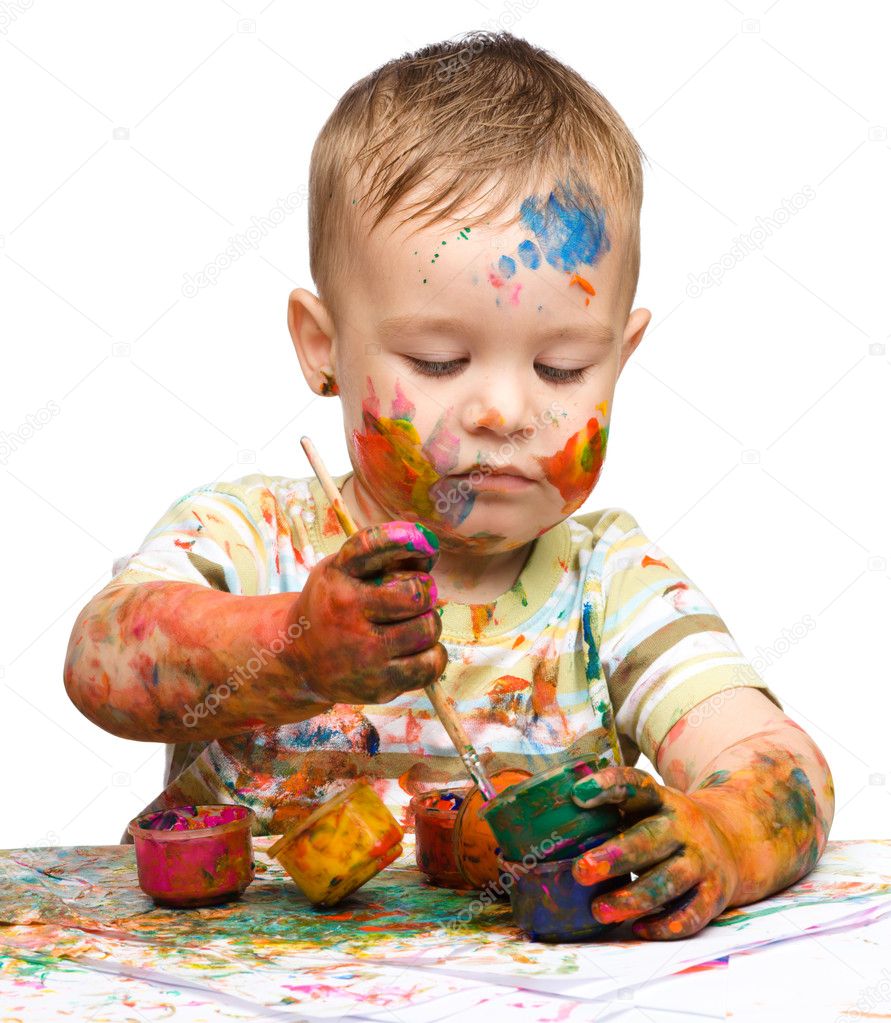 Little boy is playing with paints Stock Photo by ©Kobyakov 11473571