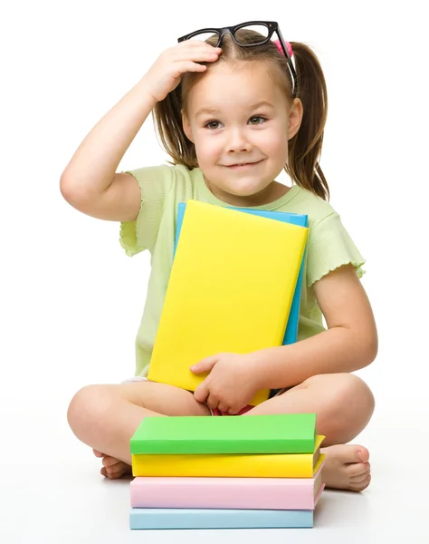Cute little girl with books — Stock Photo, Image